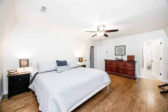 bedroom with hardwood / wood-style floors and ceiling fan