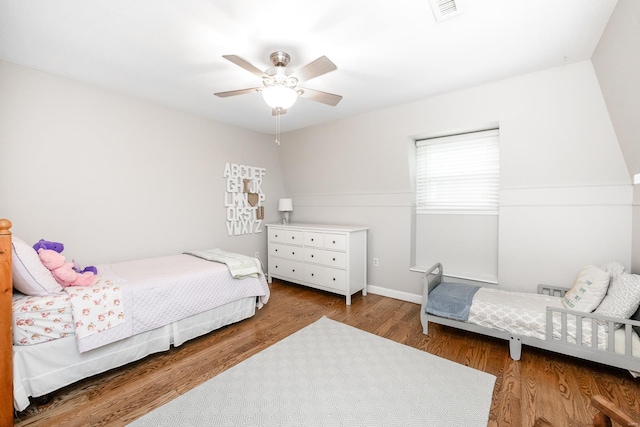 bedroom with hardwood / wood-style floors and ceiling fan