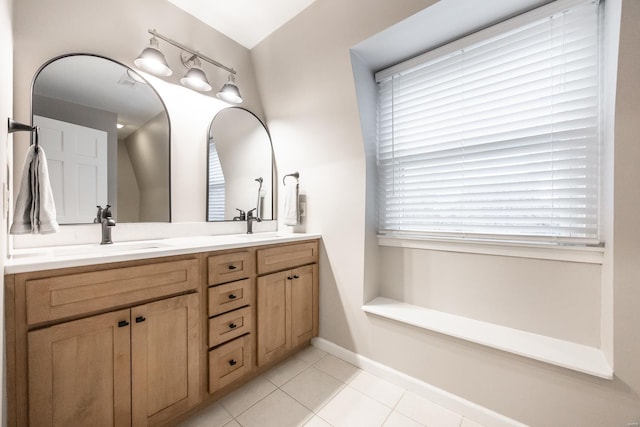 bathroom featuring tile patterned flooring and vanity