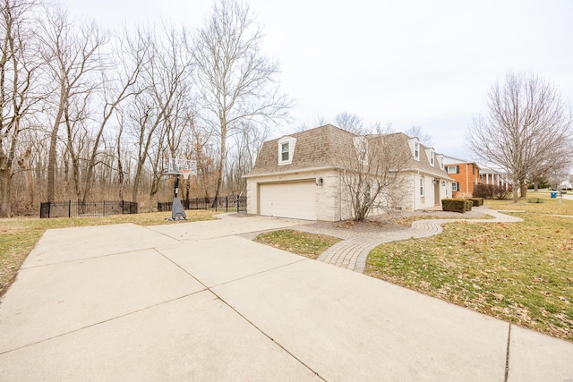 view of property exterior with a garage and a lawn