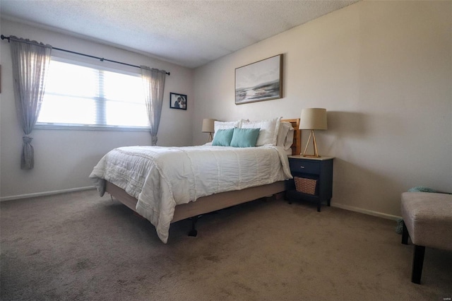 carpeted bedroom with a textured ceiling