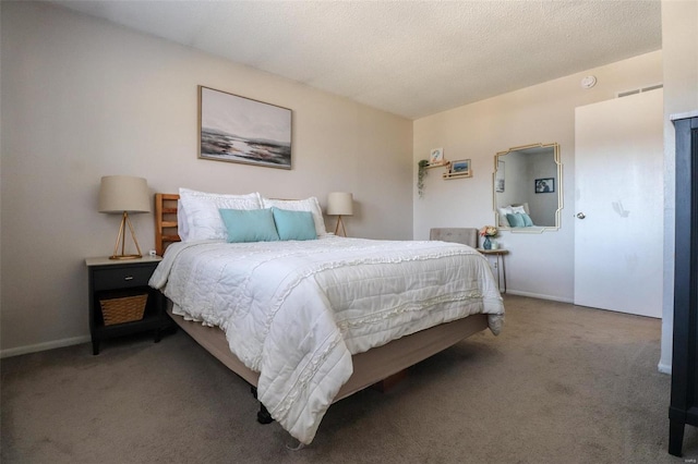 carpeted bedroom with a textured ceiling