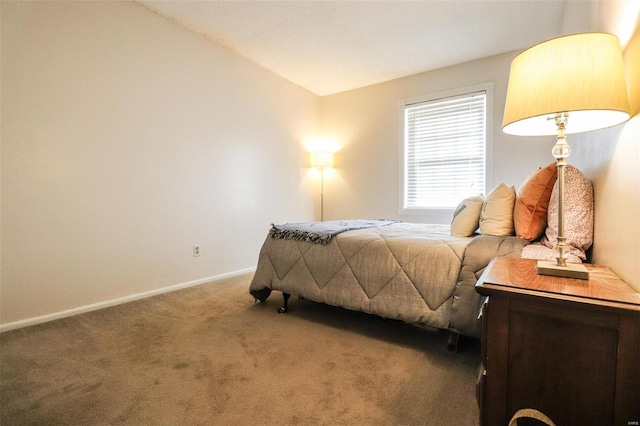 carpeted bedroom with lofted ceiling