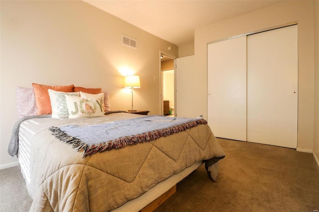 carpeted bedroom with a closet