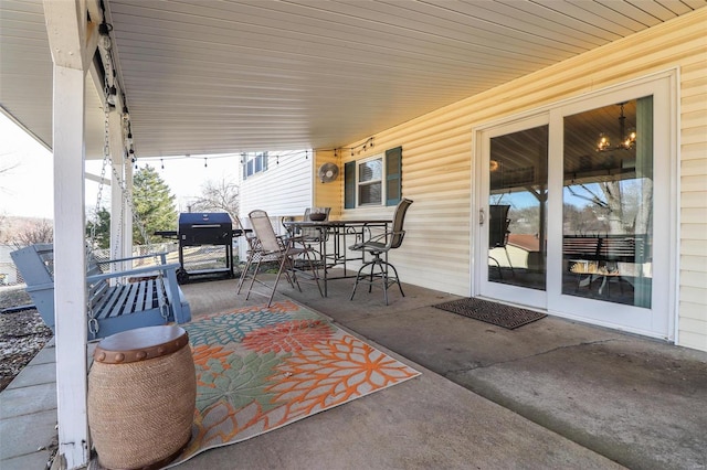 view of patio featuring a grill