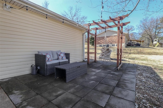 view of patio featuring outdoor lounge area and a pergola