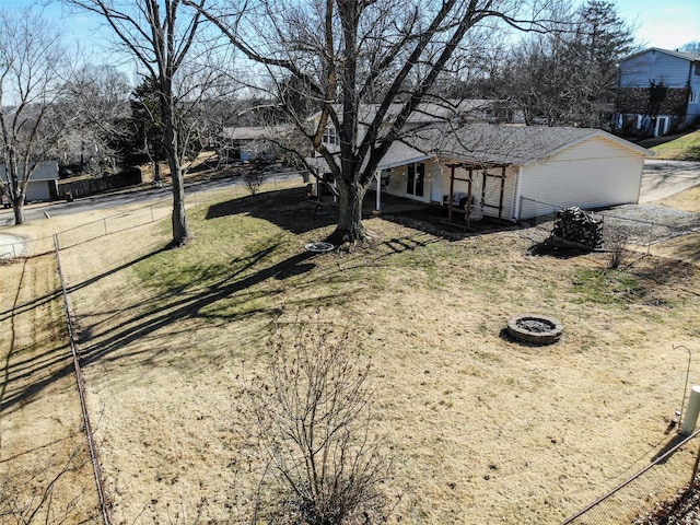 view of yard with a fire pit