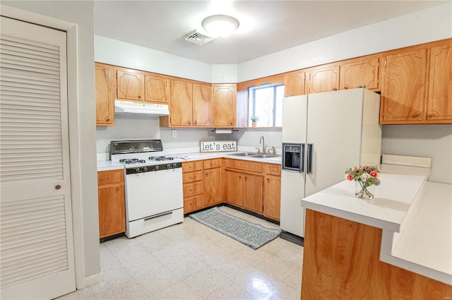 kitchen featuring sink and white appliances