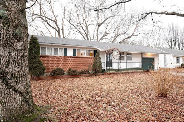 single story home with a garage