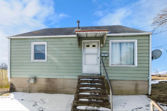 bungalow-style house featuring entry steps