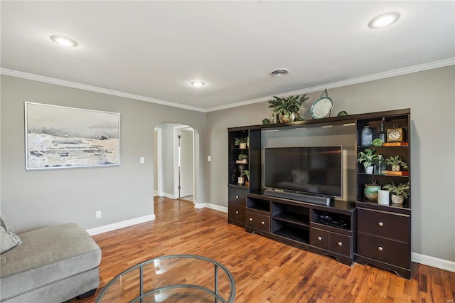 living room featuring hardwood / wood-style floors and ornamental molding