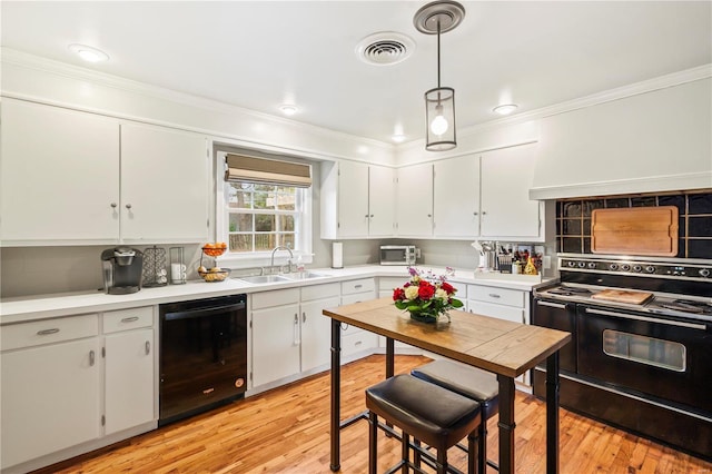 kitchen featuring white cabinets, sink, and black appliances