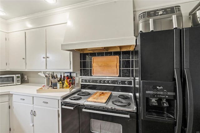 kitchen with white cabinetry, backsplash, ornamental molding, black appliances, and custom range hood