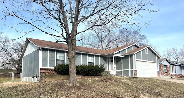 view of front facade with a garage and a front yard