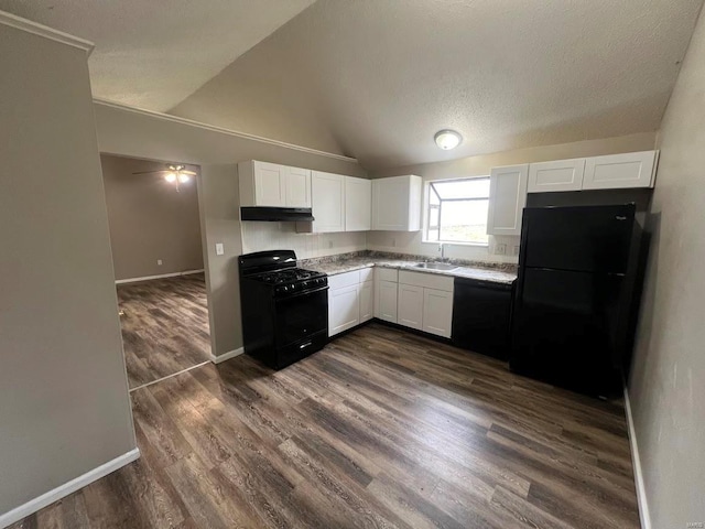 kitchen with sink, white cabinetry, vaulted ceiling, dark hardwood / wood-style flooring, and black appliances