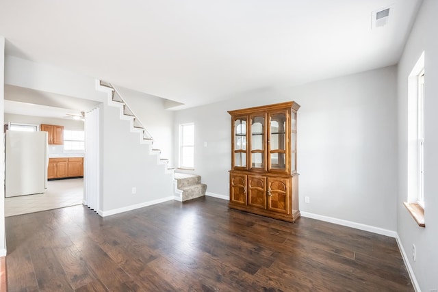 interior space with dark hardwood / wood-style floors