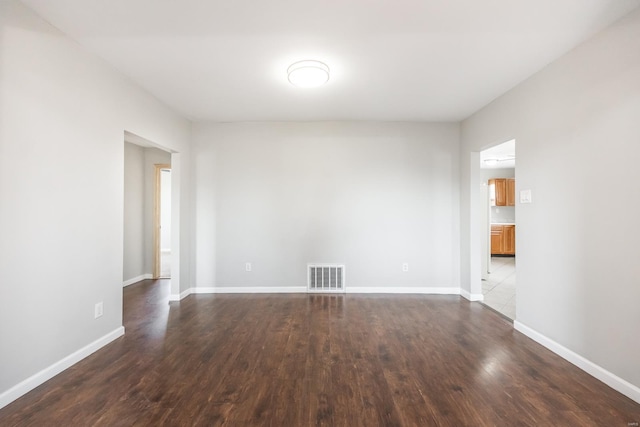 empty room featuring dark hardwood / wood-style floors