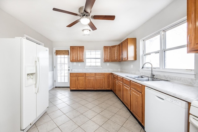 kitchen with ceiling fan, white appliances, sink, and light tile patterned floors