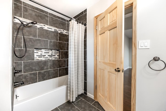 bathroom with tile patterned flooring and shower / bath combo