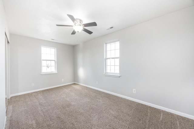 empty room with carpet and ceiling fan