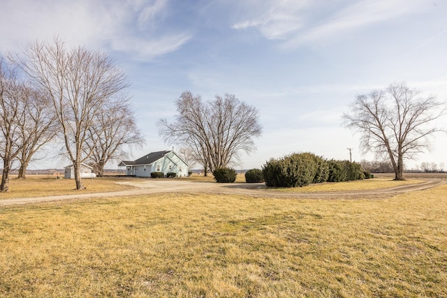 view of yard with a rural view