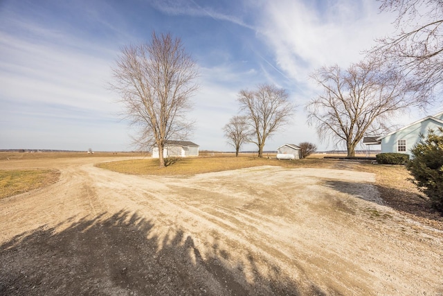 view of yard with a rural view