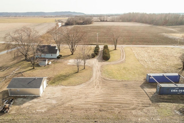 birds eye view of property with a rural view