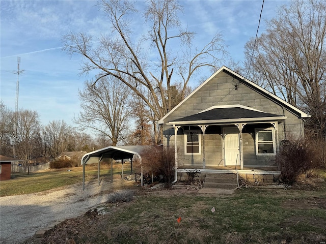 bungalow-style house with a carport and a porch