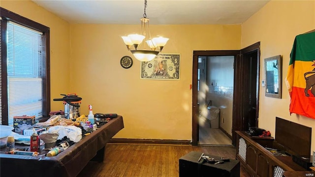 interior space featuring an inviting chandelier and wood-type flooring