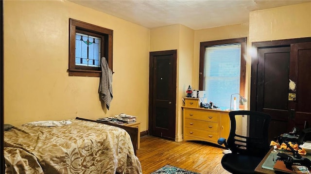 bedroom with light hardwood / wood-style floors