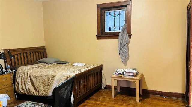 bedroom featuring dark hardwood / wood-style flooring