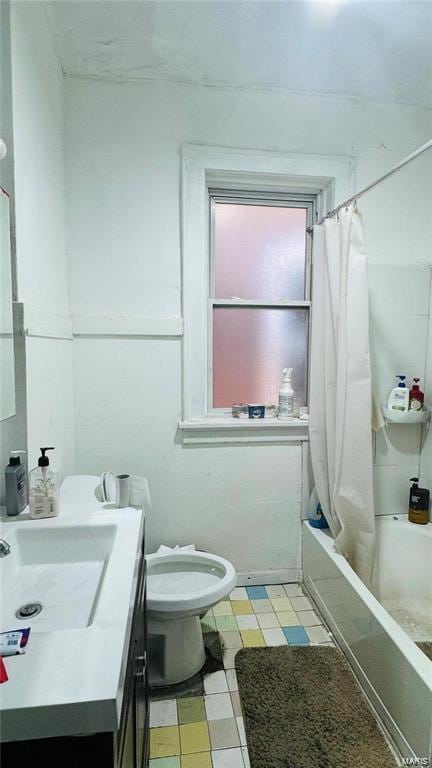 full bathroom with vanity, toilet, and shower / bath combo with shower curtain