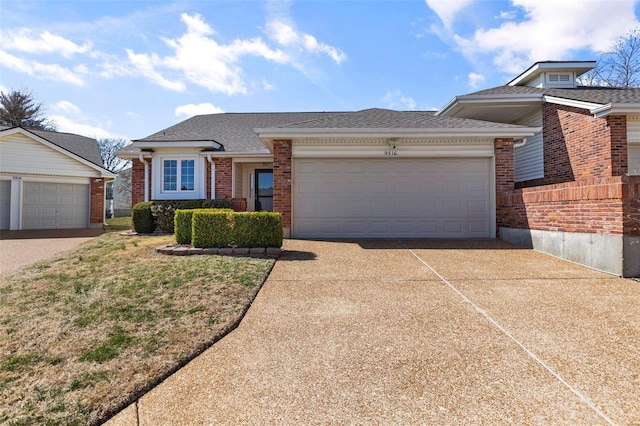 view of front of property with concrete driveway, a garage, brick siding, and roof with shingles