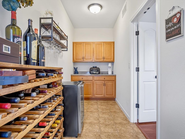 wine room with light tile patterned floors