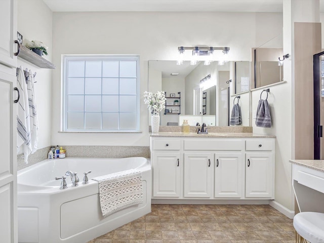 bathroom featuring vanity and a bathing tub