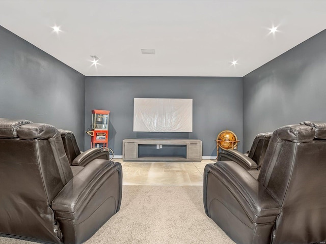 home theater featuring light carpet and a fireplace