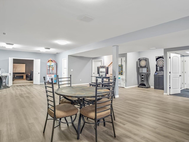 dining area with light wood-type flooring