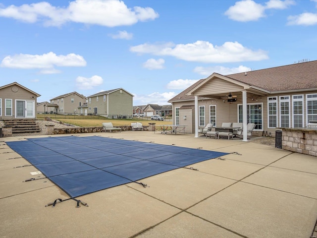 view of swimming pool featuring an outdoor hangout area, ceiling fan, and a patio area