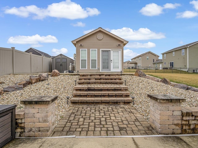 rear view of house with a shed