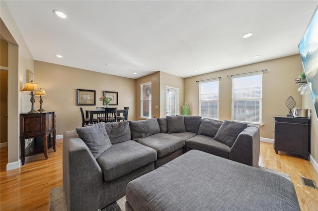 living room with light hardwood / wood-style flooring