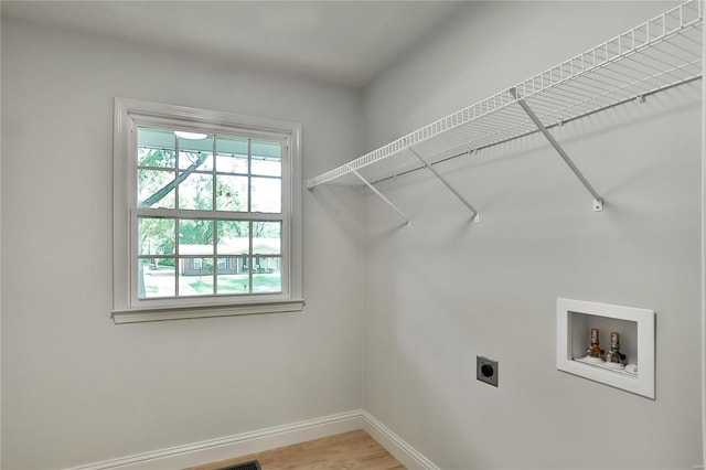 laundry room with washer hookup, hookup for an electric dryer, and wood-type flooring