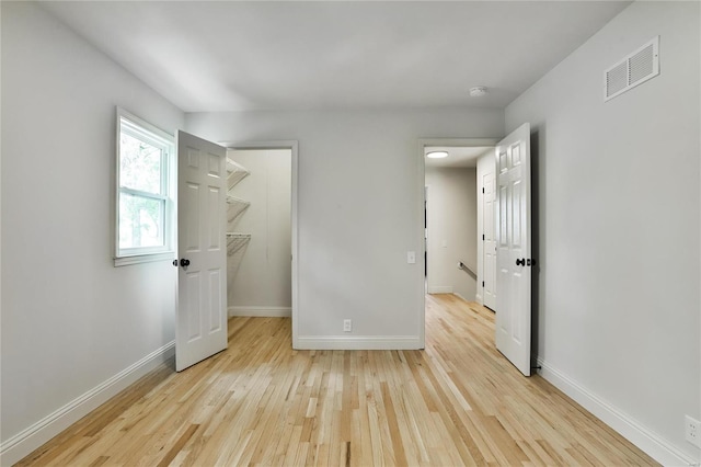 spare room with light wood-type flooring