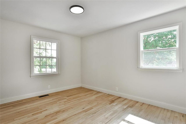 unfurnished room featuring light hardwood / wood-style floors