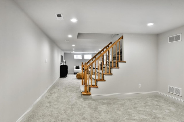 staircase with carpet