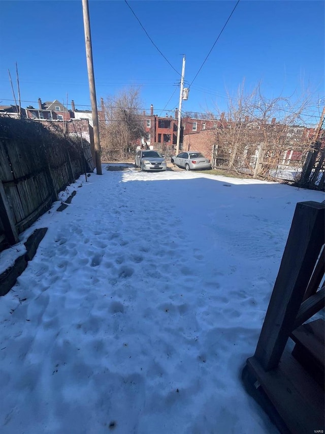 view of yard covered in snow