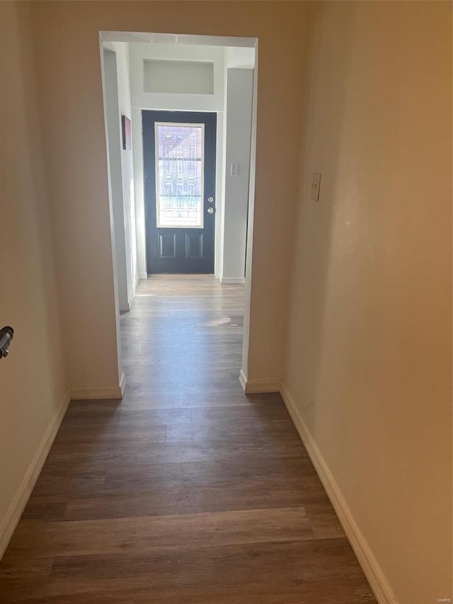 corridor with dark wood-type flooring