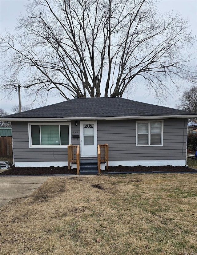 ranch-style house with a front lawn