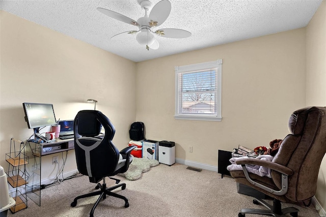 office with ceiling fan, light carpet, and a textured ceiling