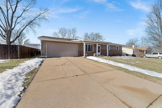 ranch-style home featuring a garage