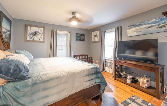 bedroom featuring hardwood / wood-style flooring and ceiling fan